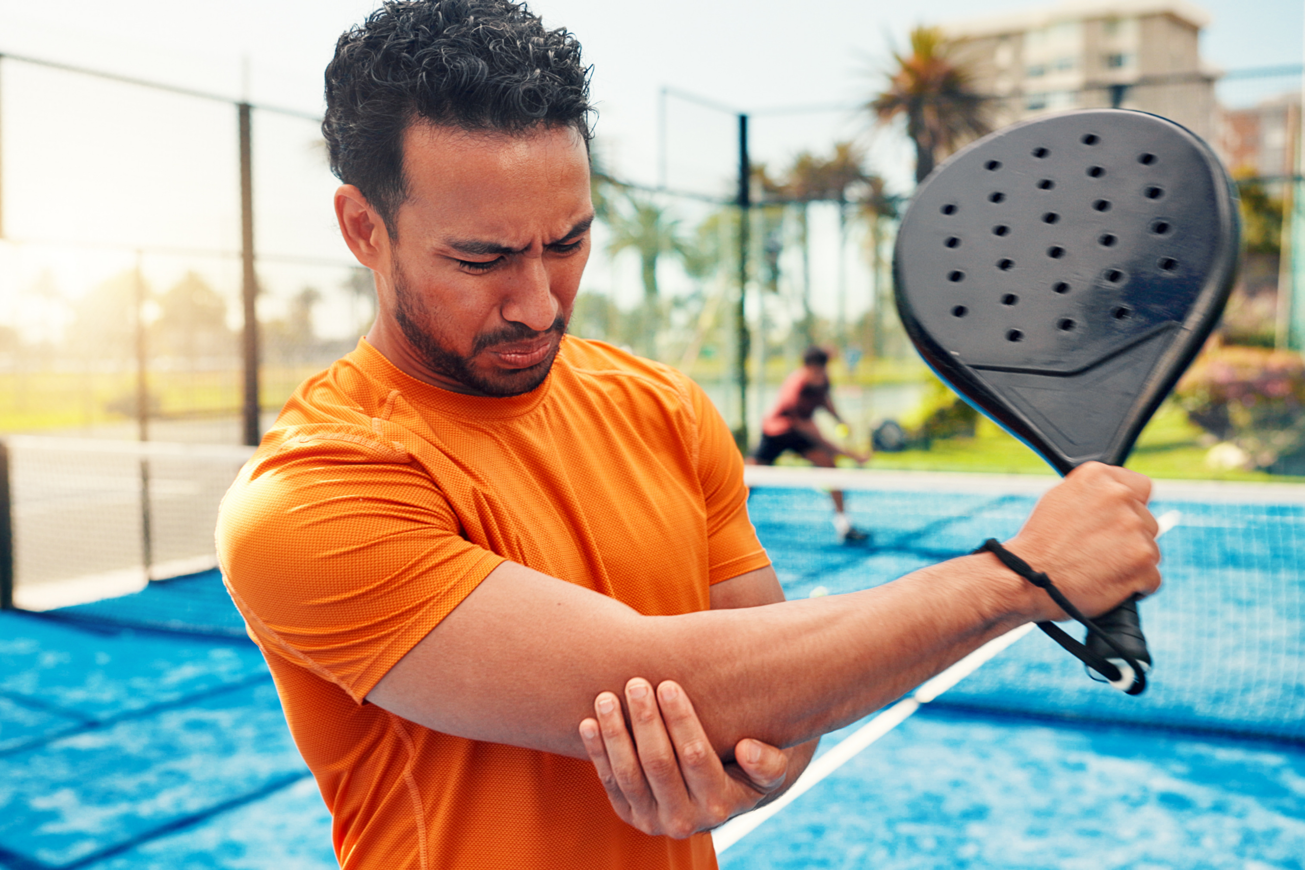 man with a arm injury playing sports